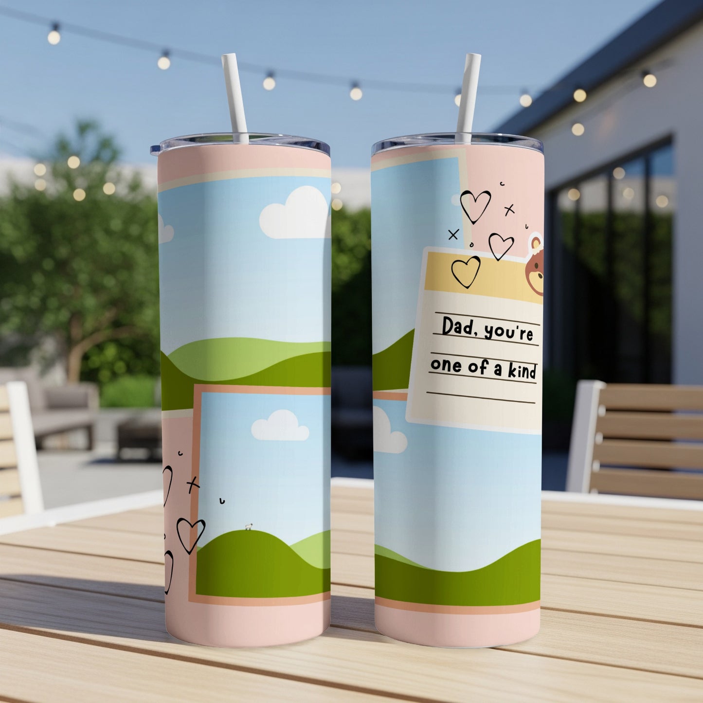 Two tumblers with cartoon landscape and hearts, one saying "Dad, you're one of a kind".