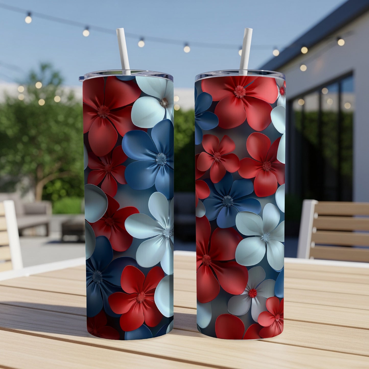 Two tumblers with red, white, and blue floral patterns on a table.