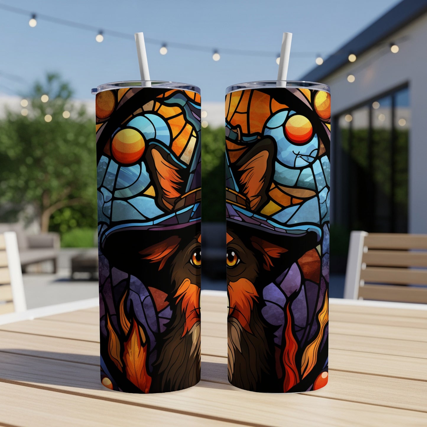 Two tumblers featuring a wolf in a witch hat with stained glass and flame designs.