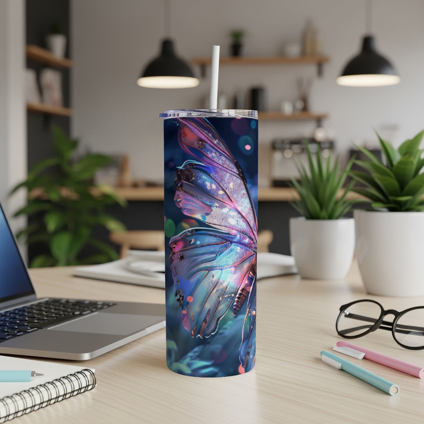 Tumbler with colorful, glowing butterfly wing design.