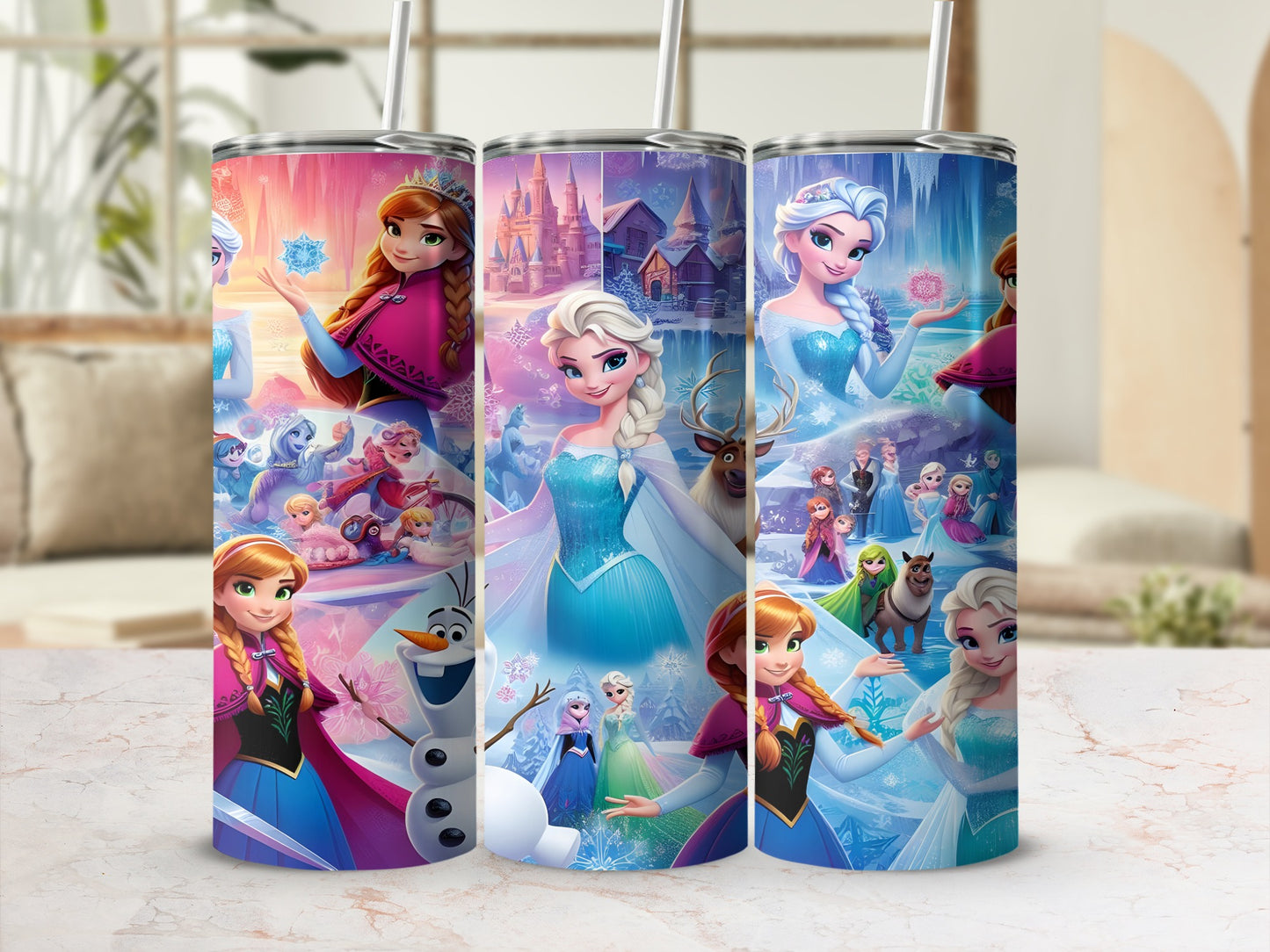 Three Frozen-themed tumblers featuring Elsa, Anna, and Olaf.