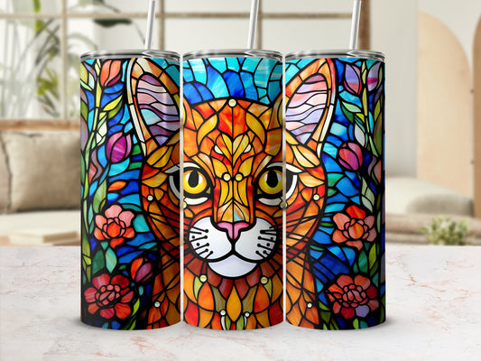 Cat face with stained glass floral pattern on three tumblers.