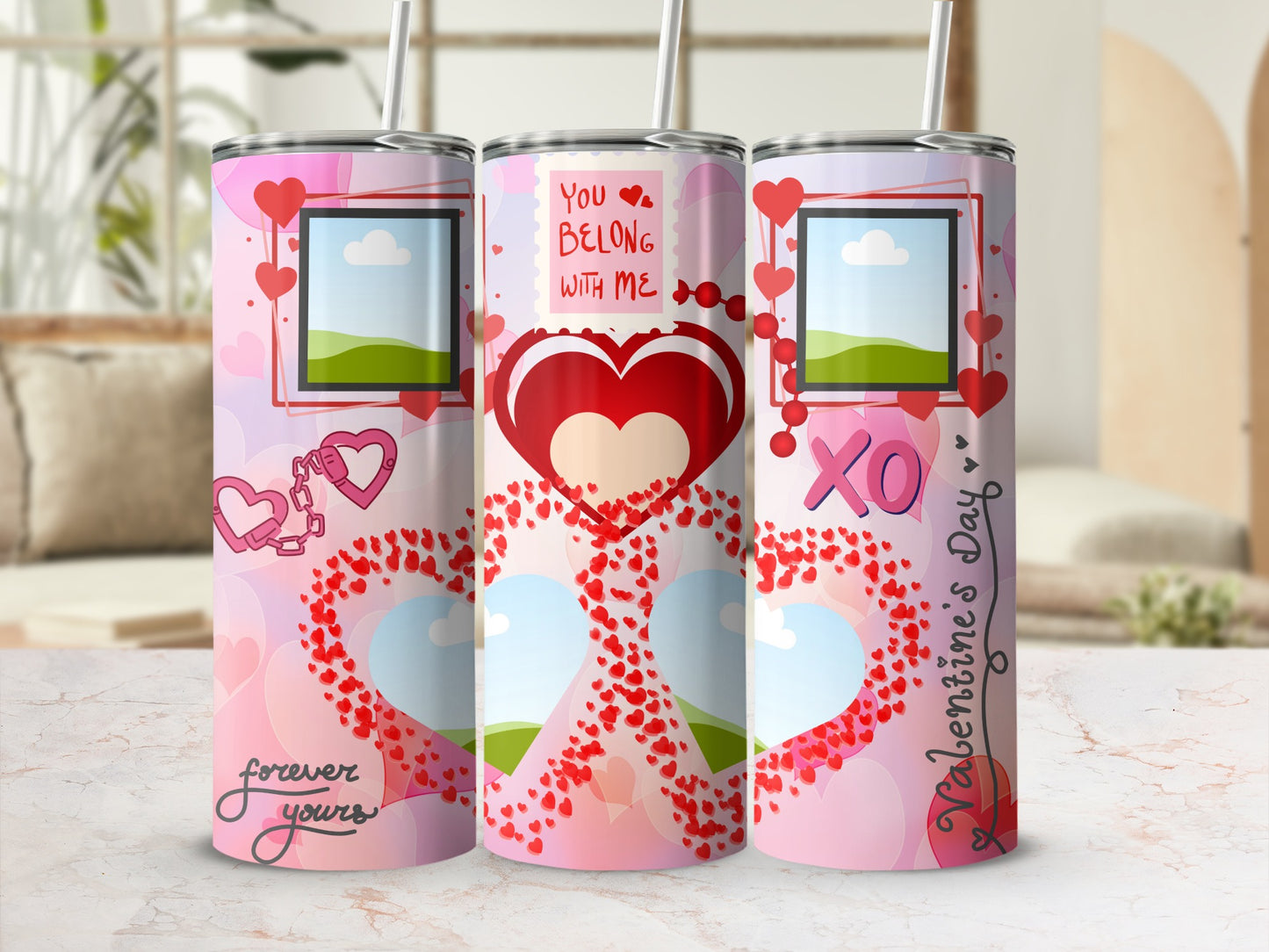 Three Valentine's Day themed tumblers with hearts, "You Belong With Me", "XO", and "Valentine's Day" text.