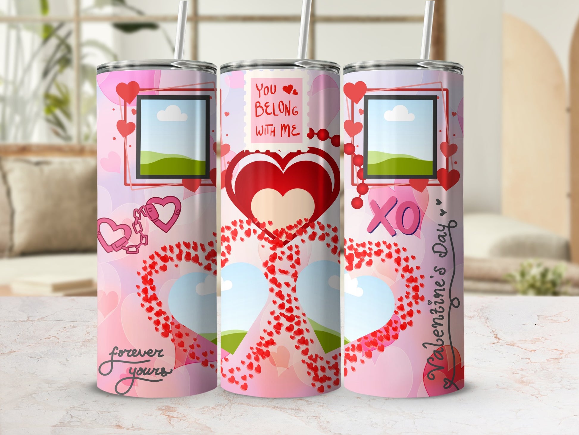 Three Valentine's Day themed tumblers with hearts, "You Belong With Me", "XO", and "Valentine's Day" text.