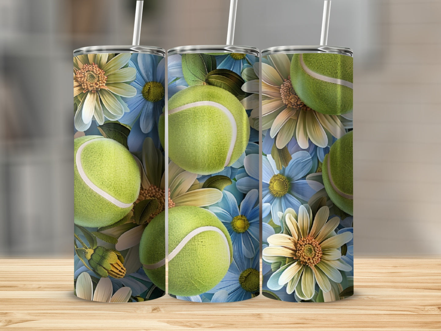 Three tumblers with tennis balls and floral pattern.