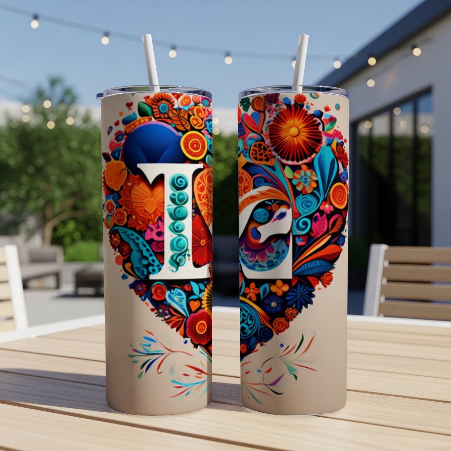 Heart-shaped floral design with "T" and "L" on two tan tumblers.