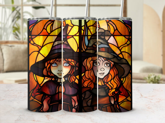 Stained glass tumbler with witch illustrations and straw.