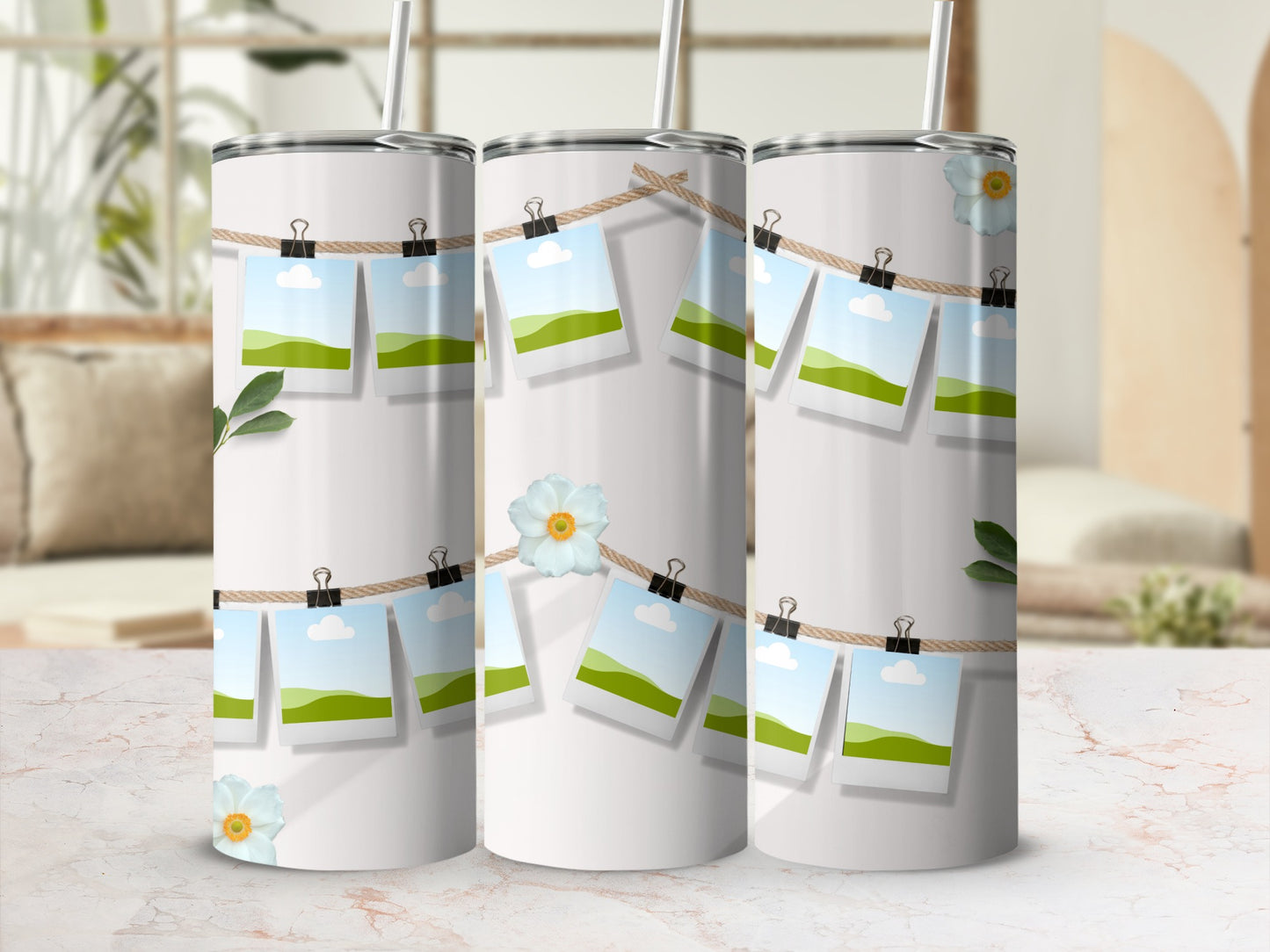 White tumblers with photos clipped to a twine line and floral accents.