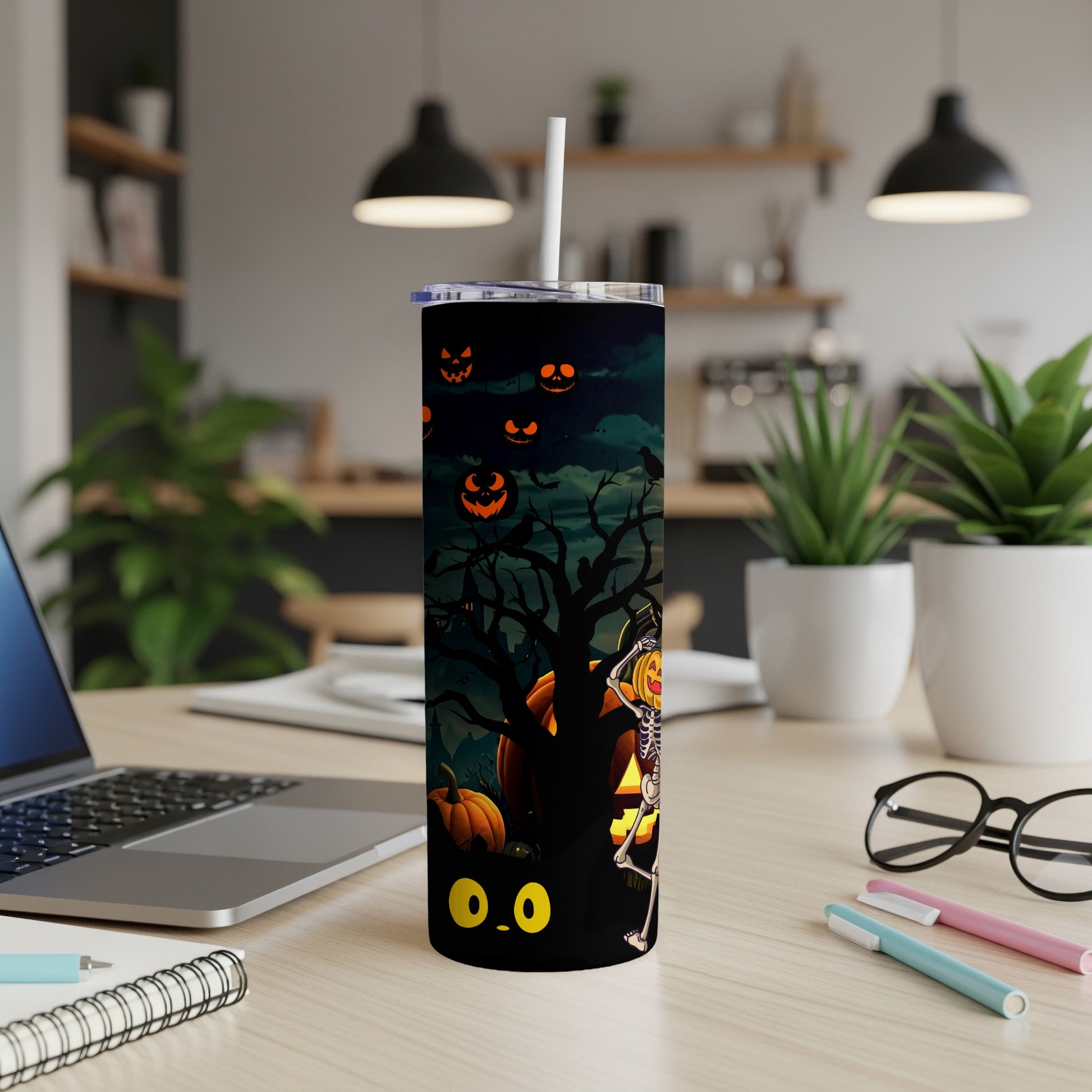 Halloween tumbler with black cat, skeleton, pumpkins, bats, and jack-o'-lanterns.