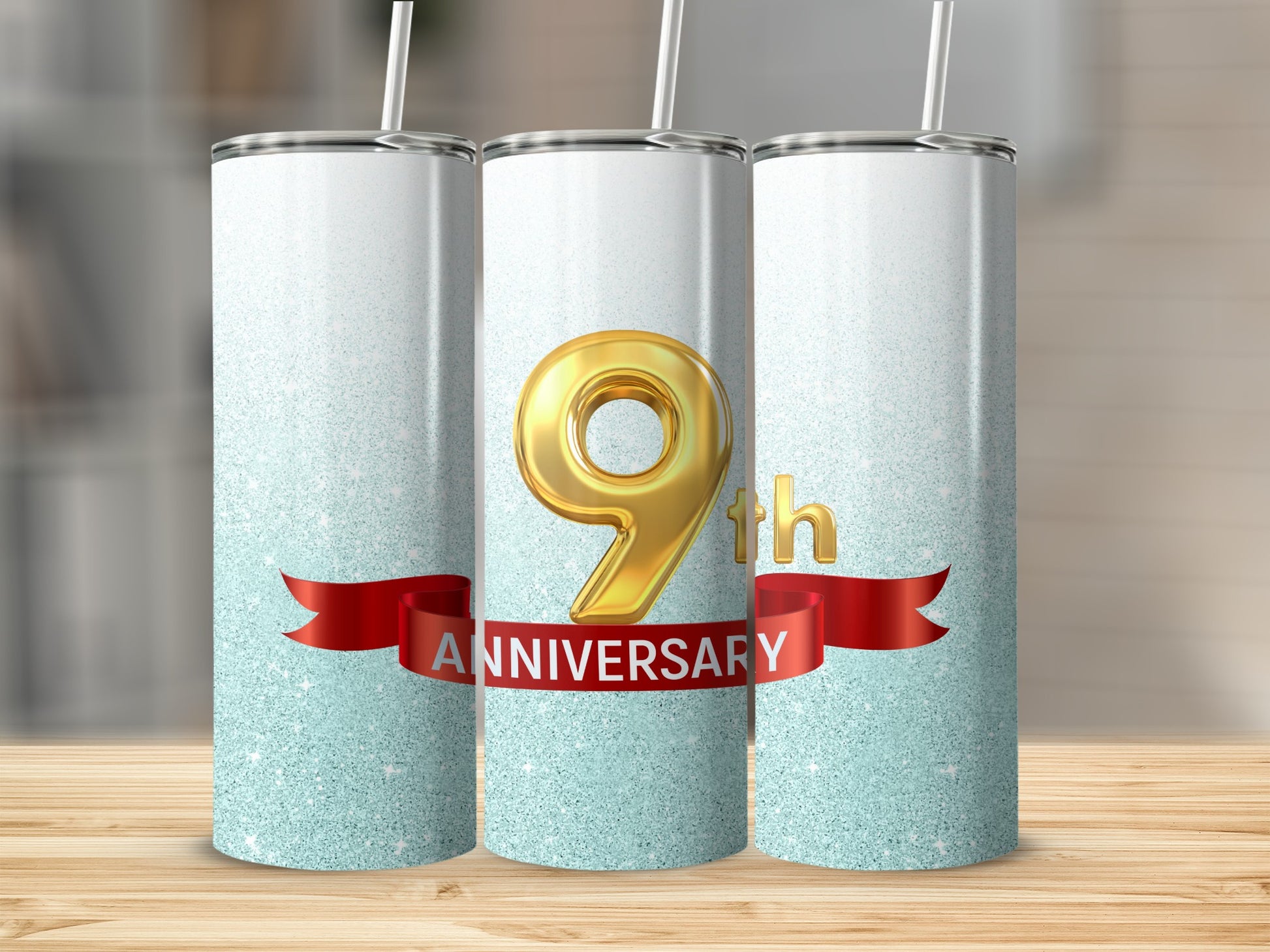 Three tumblers with "9th Anniversary" text on a red ribbon.
