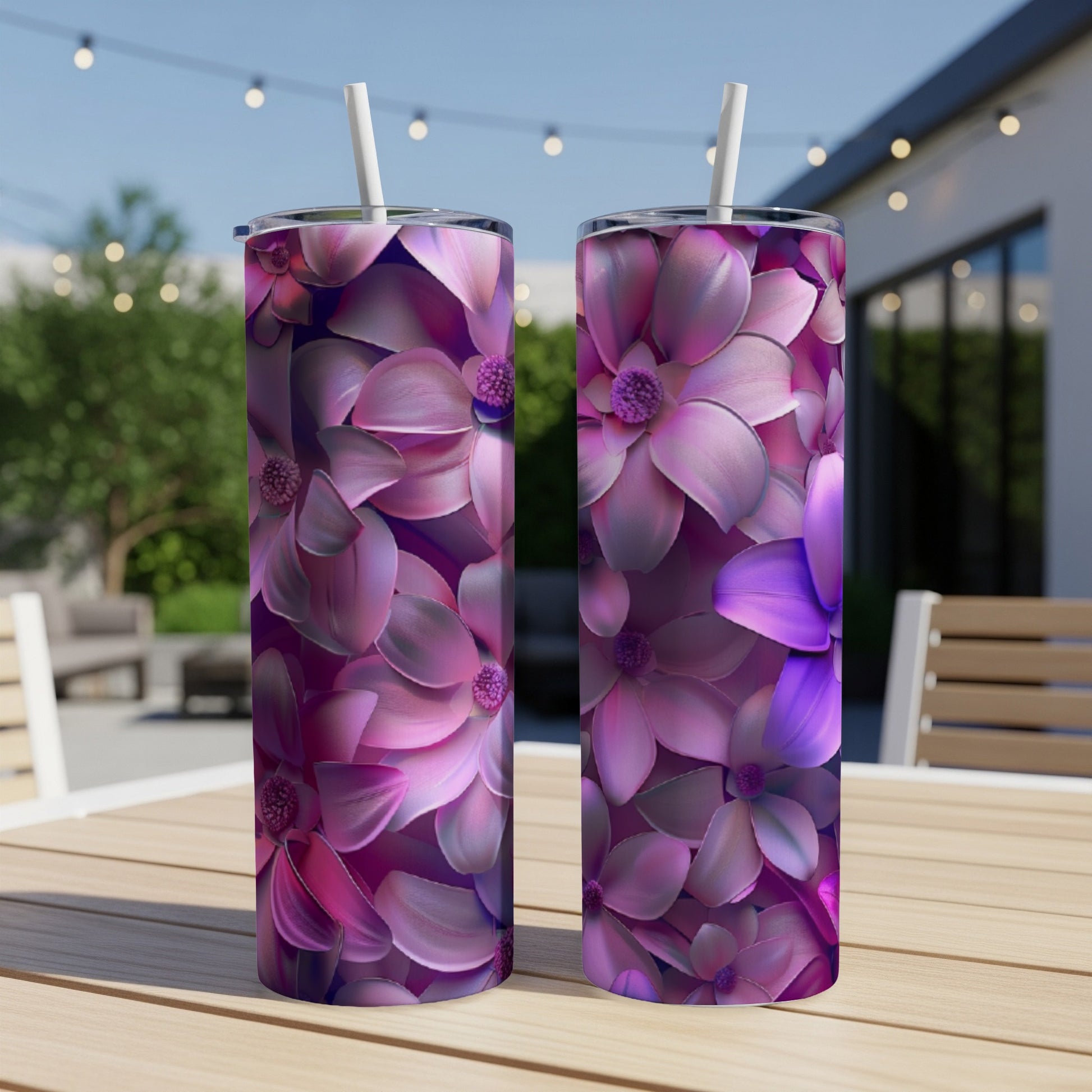 Two tumblers with a vibrant floral pattern of pink and purple flowers.
