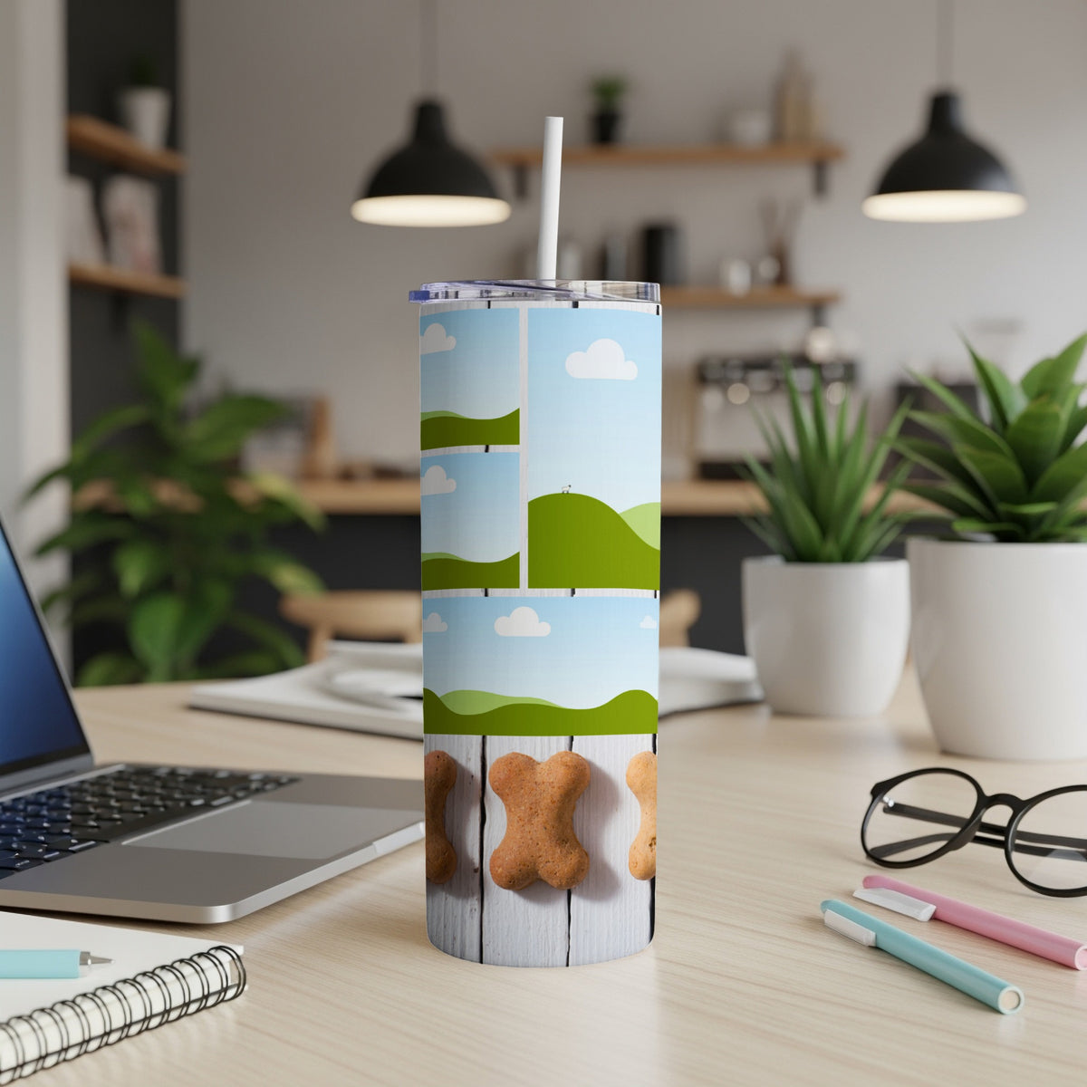 Tumbler with sky, clouds, hills, and dog bone graphics.