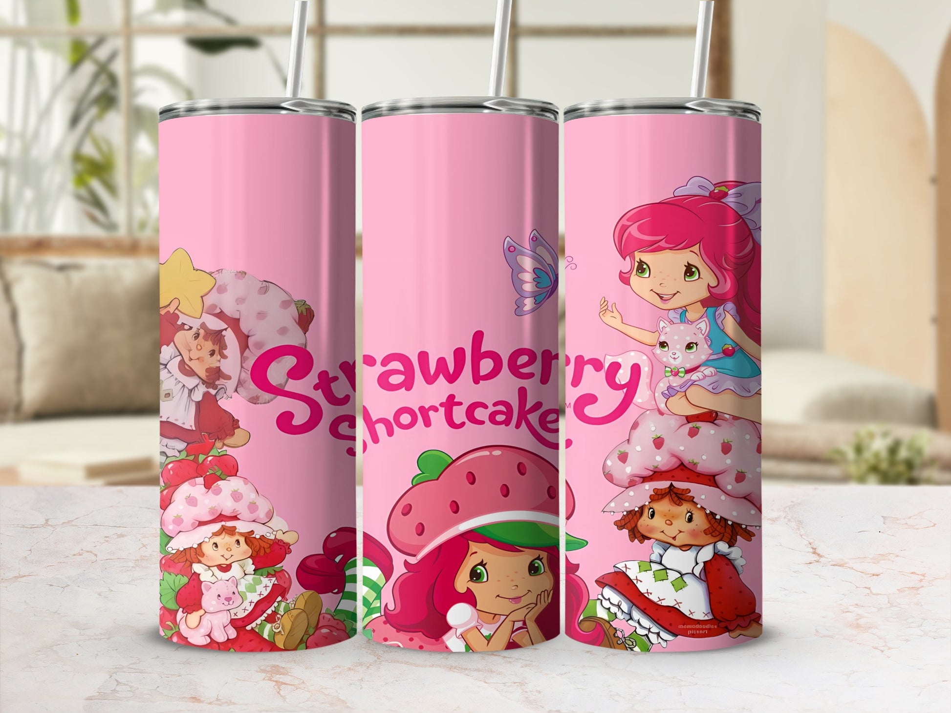 Strawberry Shortcake and friends on a pink tumbler with straw.