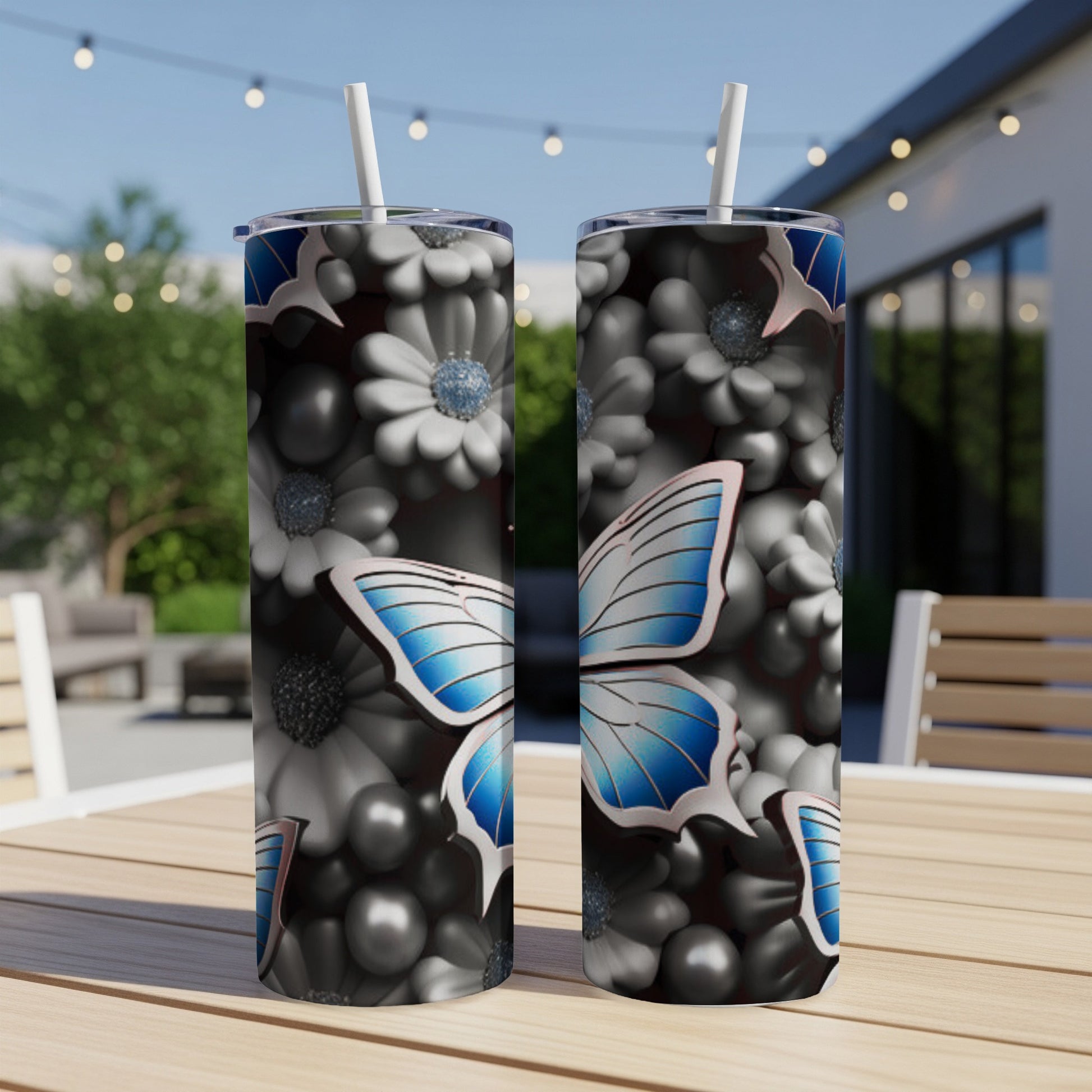 Two stainless steel tumblers with a butterfly and floral pattern.