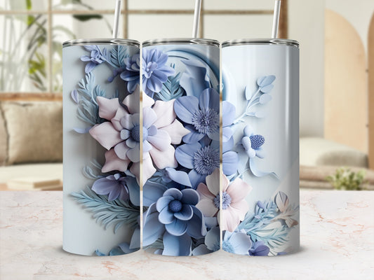 Three tumblers with blue and pink floral designs on a light background.