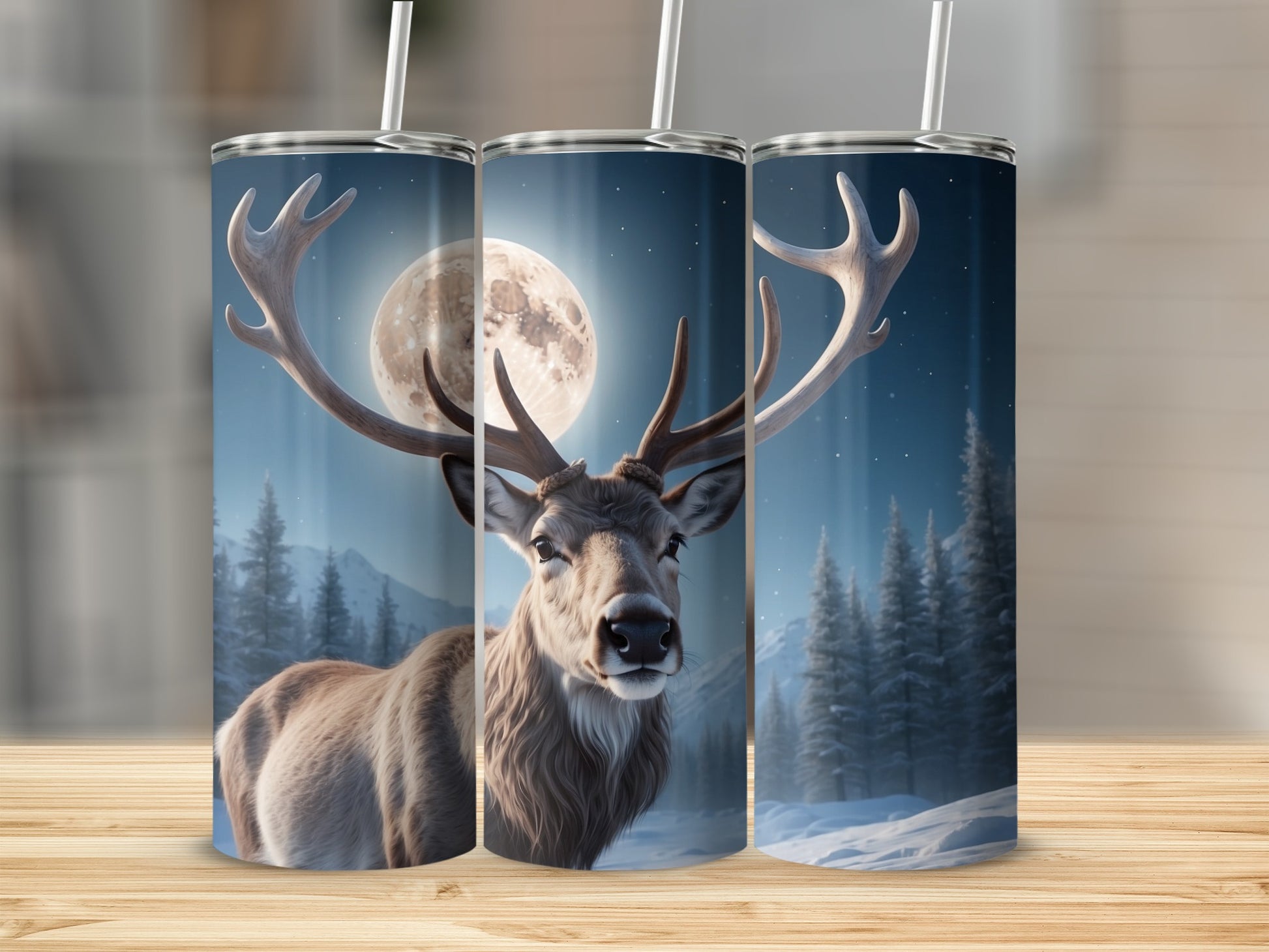 Deer against moonlit winter forest, on three cylindrical tumblers.