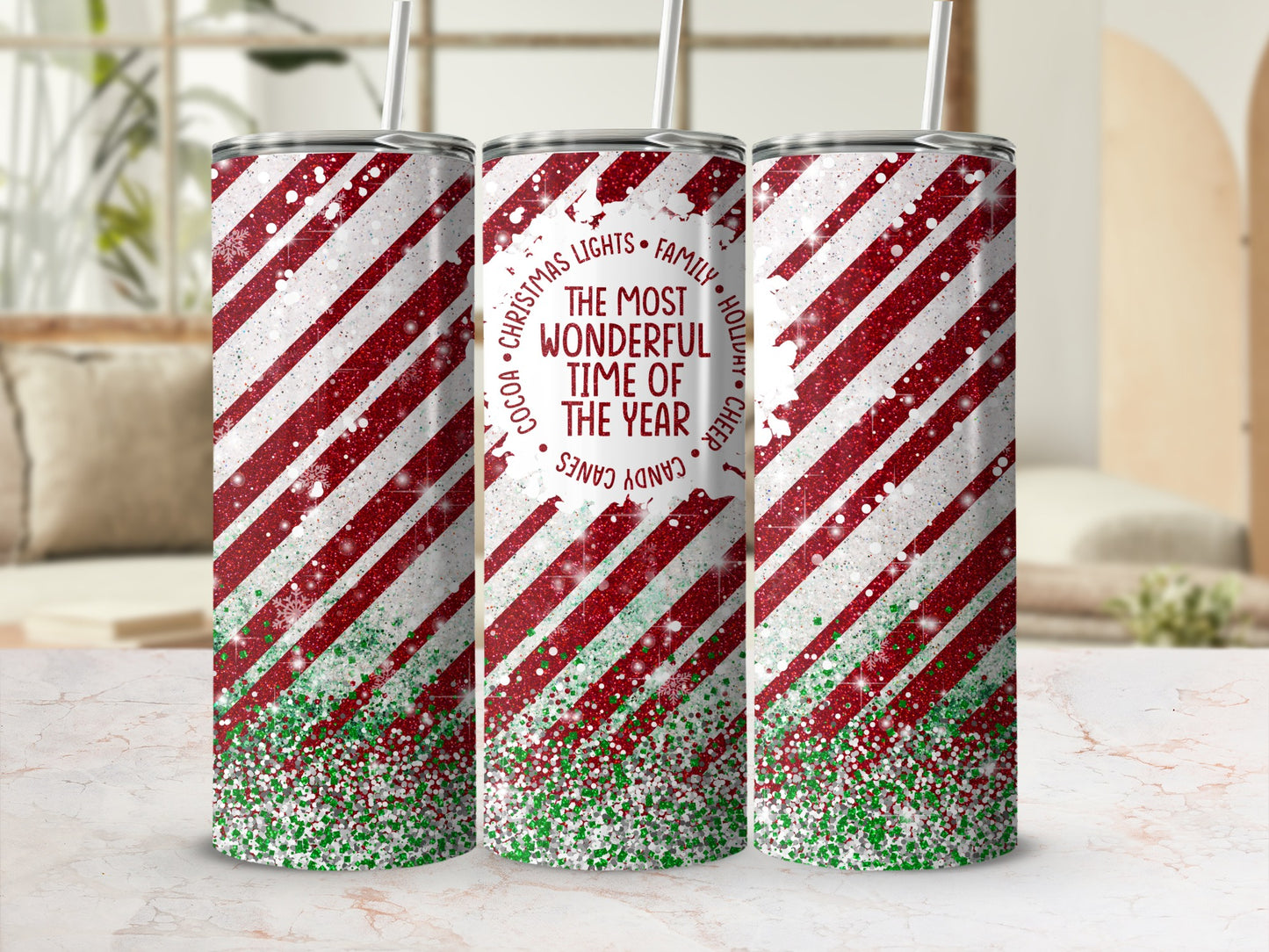 Red and white striped tumbler with glitter and "The Most Wonderful Time of Year" text.