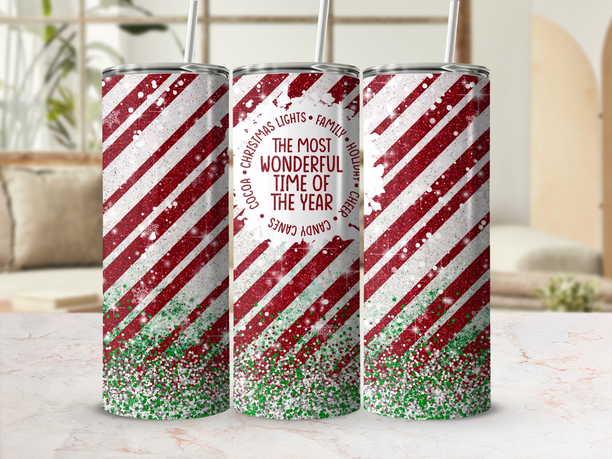 Red and white striped tumbler with glitter and "The Most Wonderful Time of Year" text.