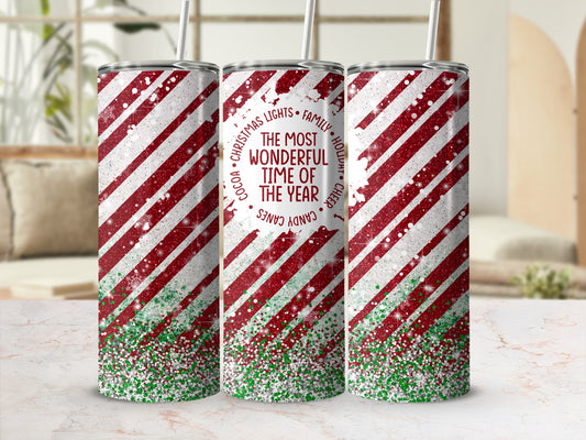 Red and white striped tumbler with glitter and "The Most Wonderful Time of Year" text.