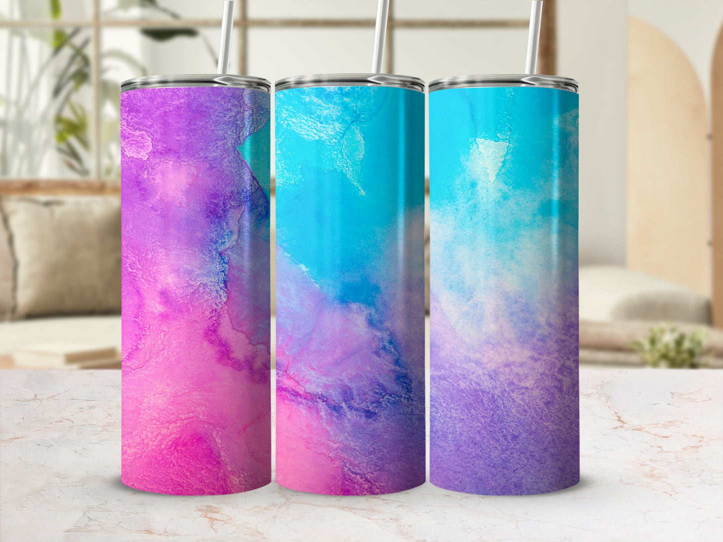 Three tumblers with a pink, purple, and blue watercolor design.