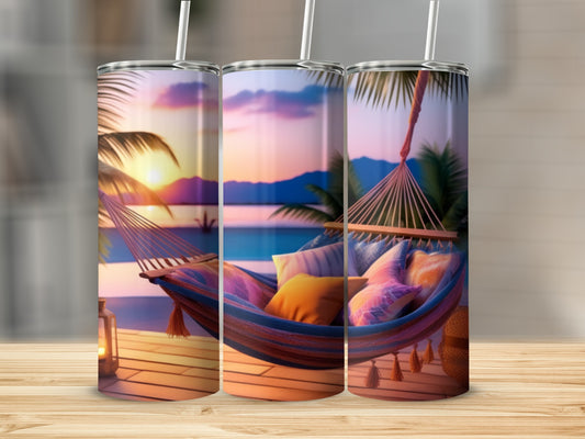 Hammock with colorful pillows on a beach at sunset, beach decor tumbler.