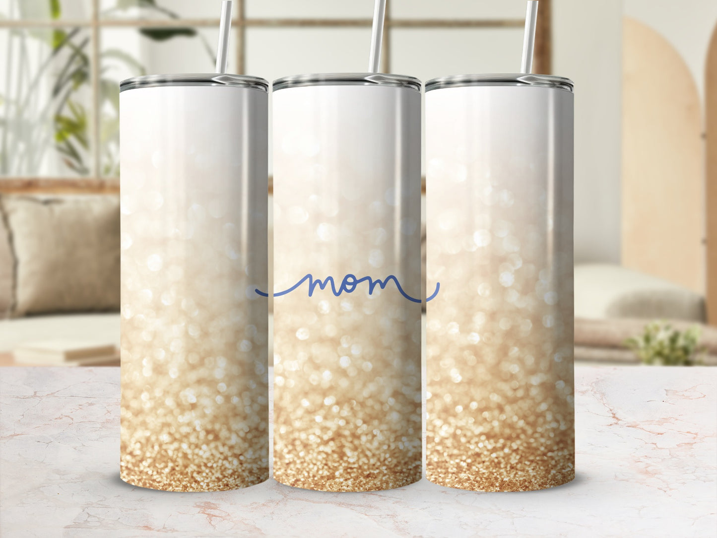 White tumbler with gold glitter and "Mom" in cursive.