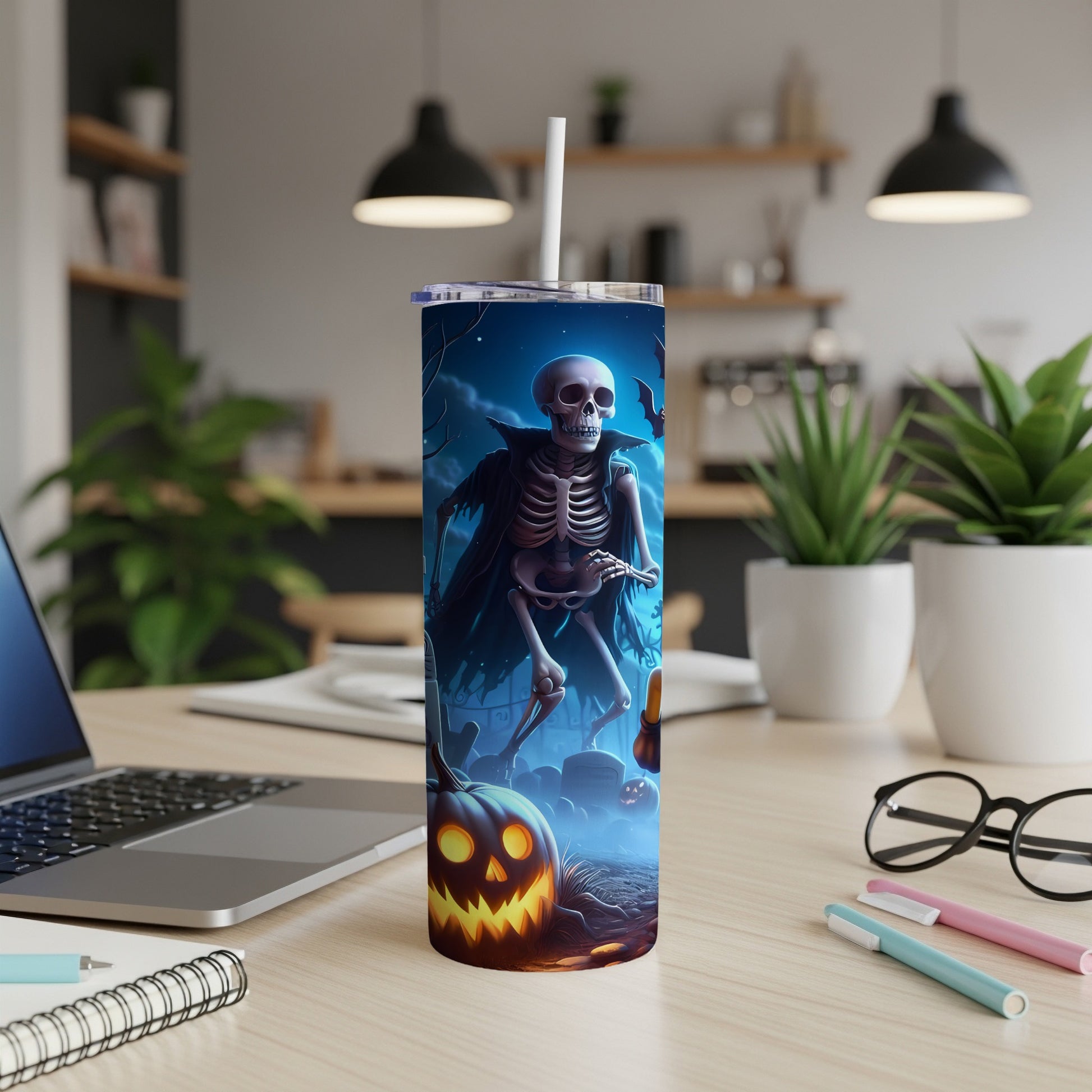 Tumbler with a spooky skeleton and jack-o'-lantern Halloween graphic.