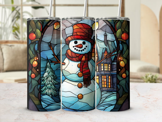 Snowman with scarf and hat in stained glass winter scene with house and tree.