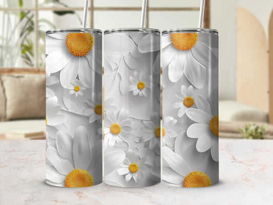 White daisy floral pattern on a set of three tall, cylindrical tumblers.