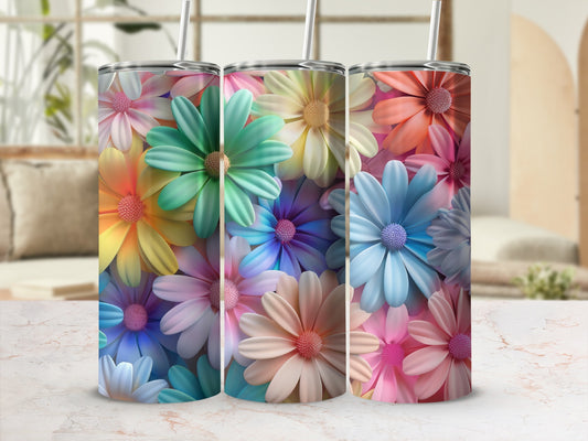 Tumbler with colorful floral pattern and straws, pink background.