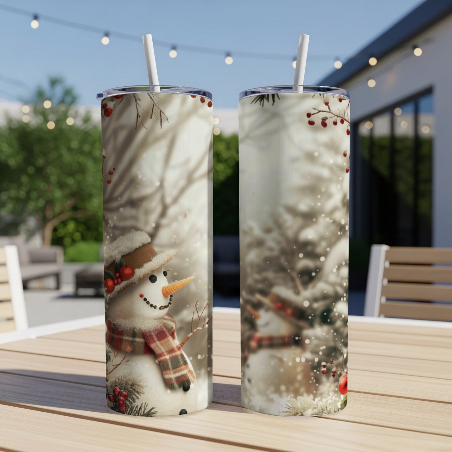 Two tumblers with a snowman design featuring a scarf and hat.