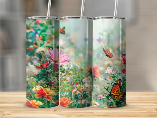 Three tumblers with a vibrant floral and butterfly design.