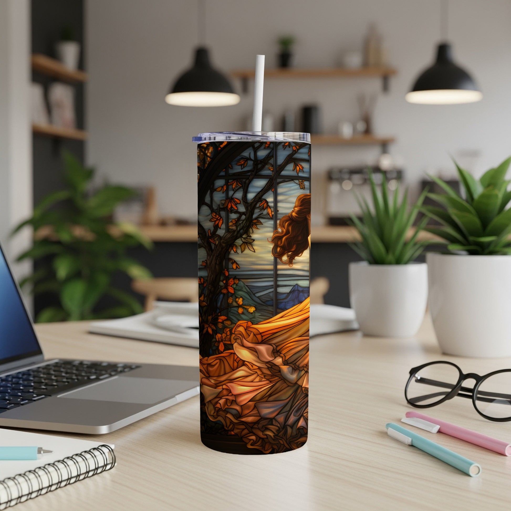 Stained glass-style tumbler with woman in flowing dress and autumn scenery.