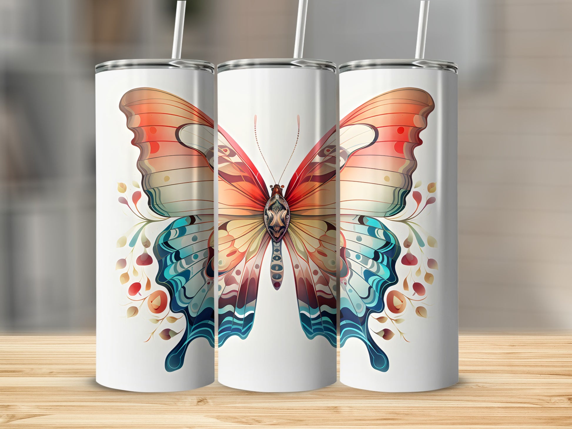 Three tumblers featuring a vibrant, colorful butterfly design with floral accents.