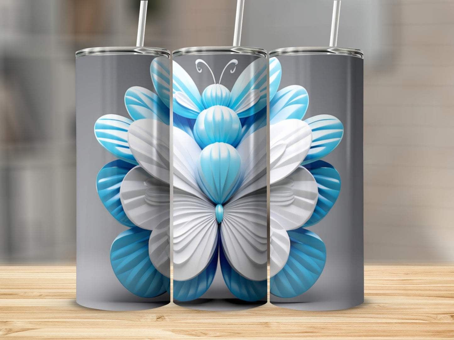 Three tumblers with a blue and white butterfly design.