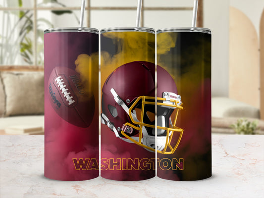Washington football helmet and ball with smoky background.