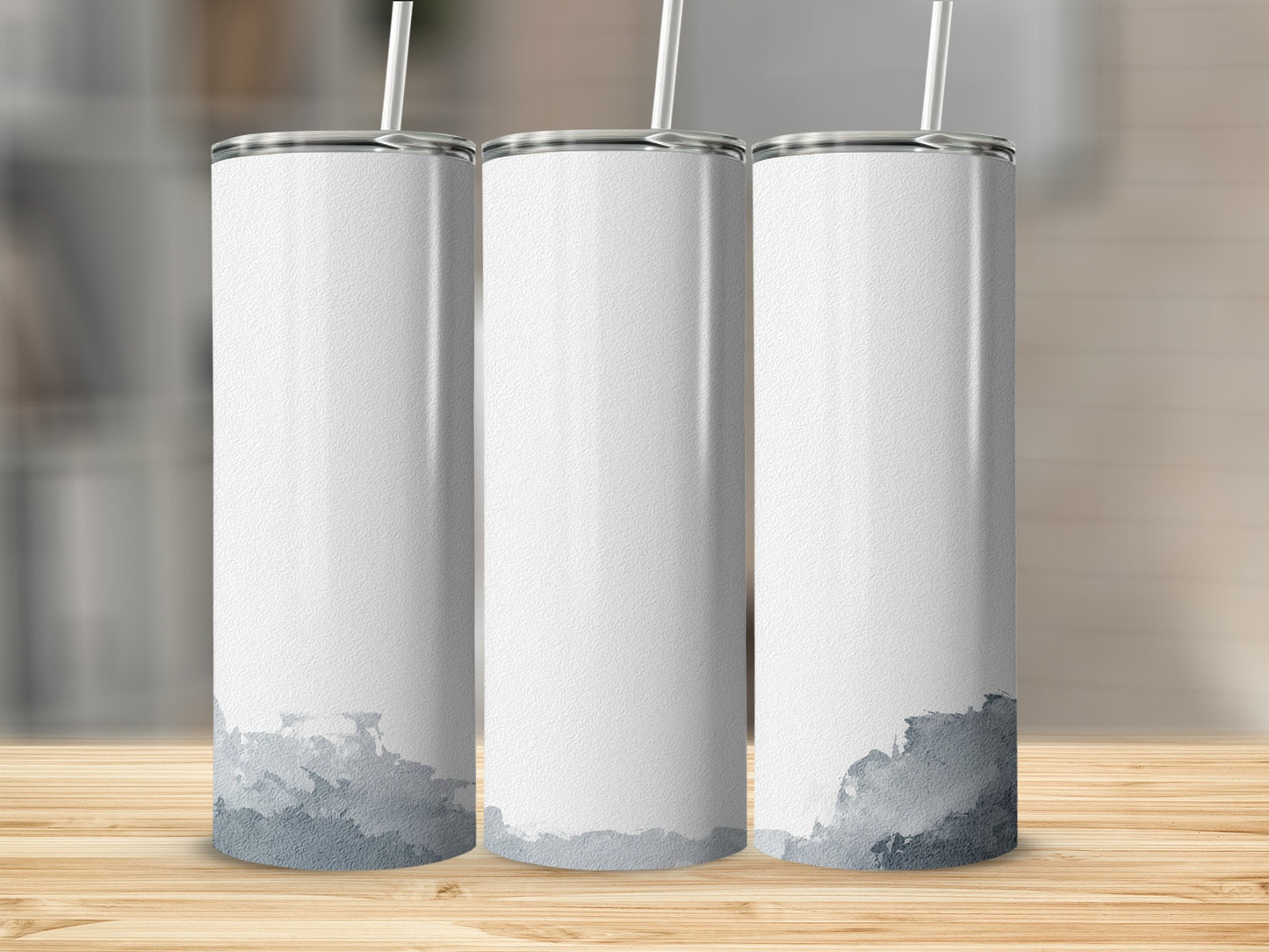 Three white tumblers with watercolor gray abstract design on wooden surface.
