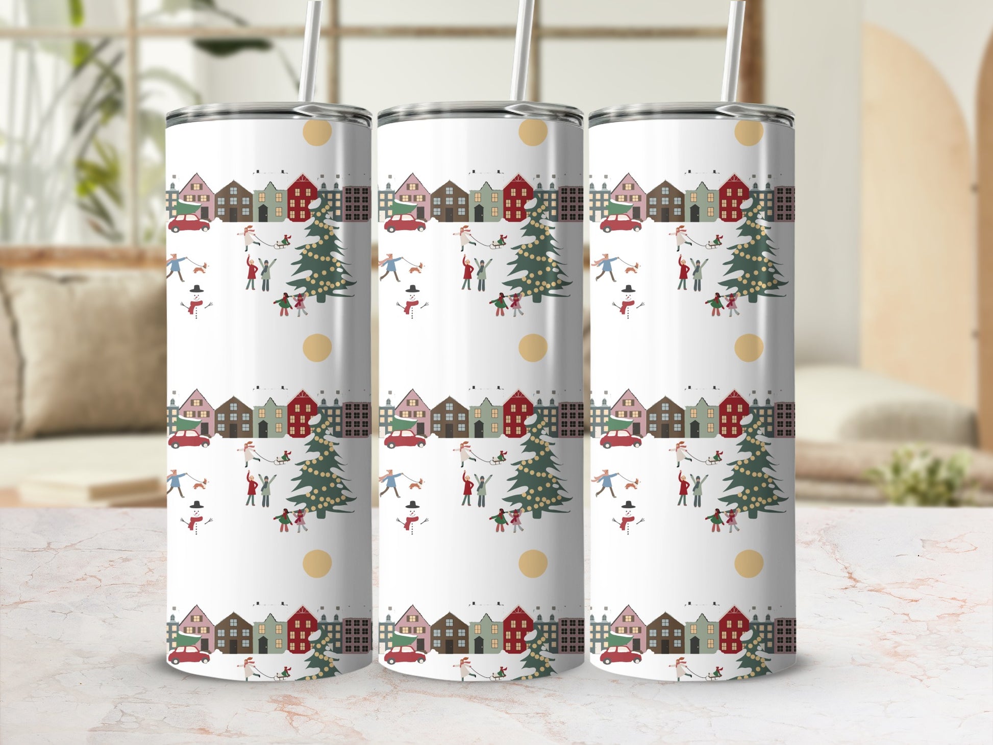 Three tumblers with a Christmas village, trees, and people pattern.