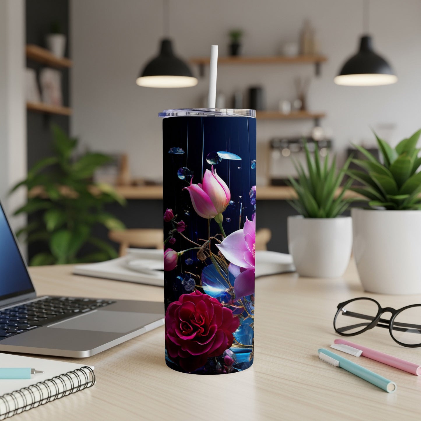 Floral design on a dark background with blue accents and a straw.