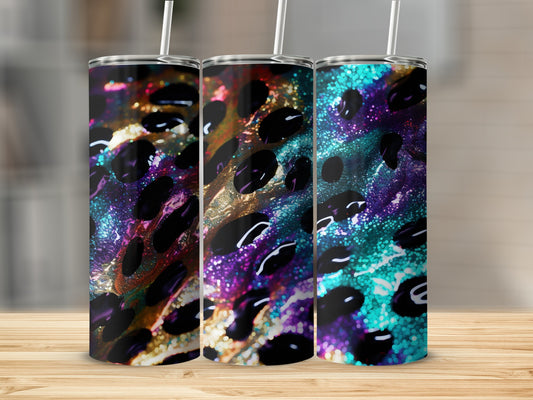 Three tumblers with a colorful, abstract leopard print design and straw.