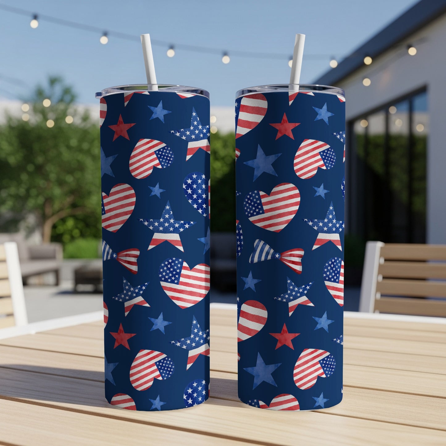 Two tumblers with patriotic stars, hearts, and stripes pattern on a blue background.
