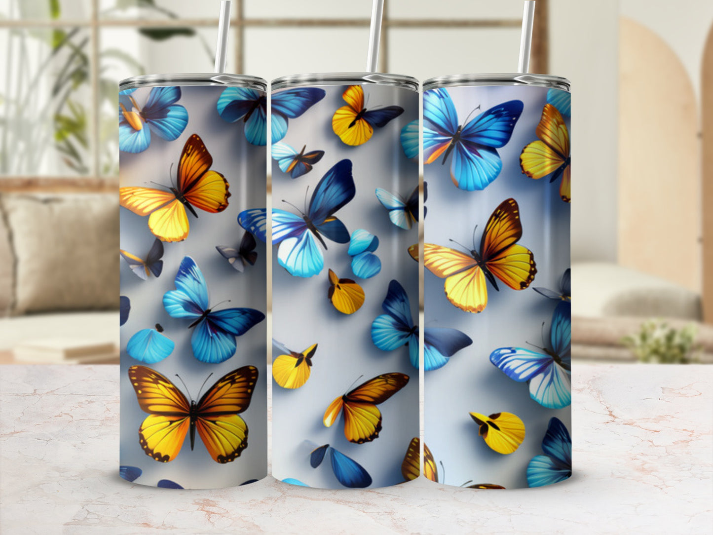 Three tumblers with a colorful butterfly pattern.