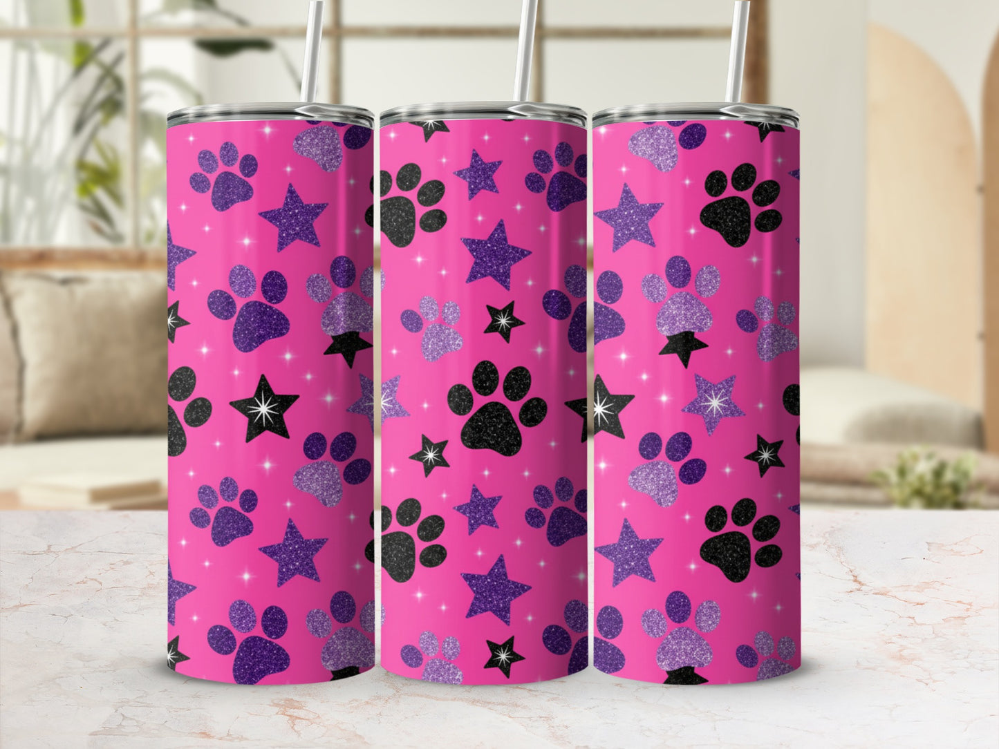Pink tumbler with paw prints and stars, a modern design.