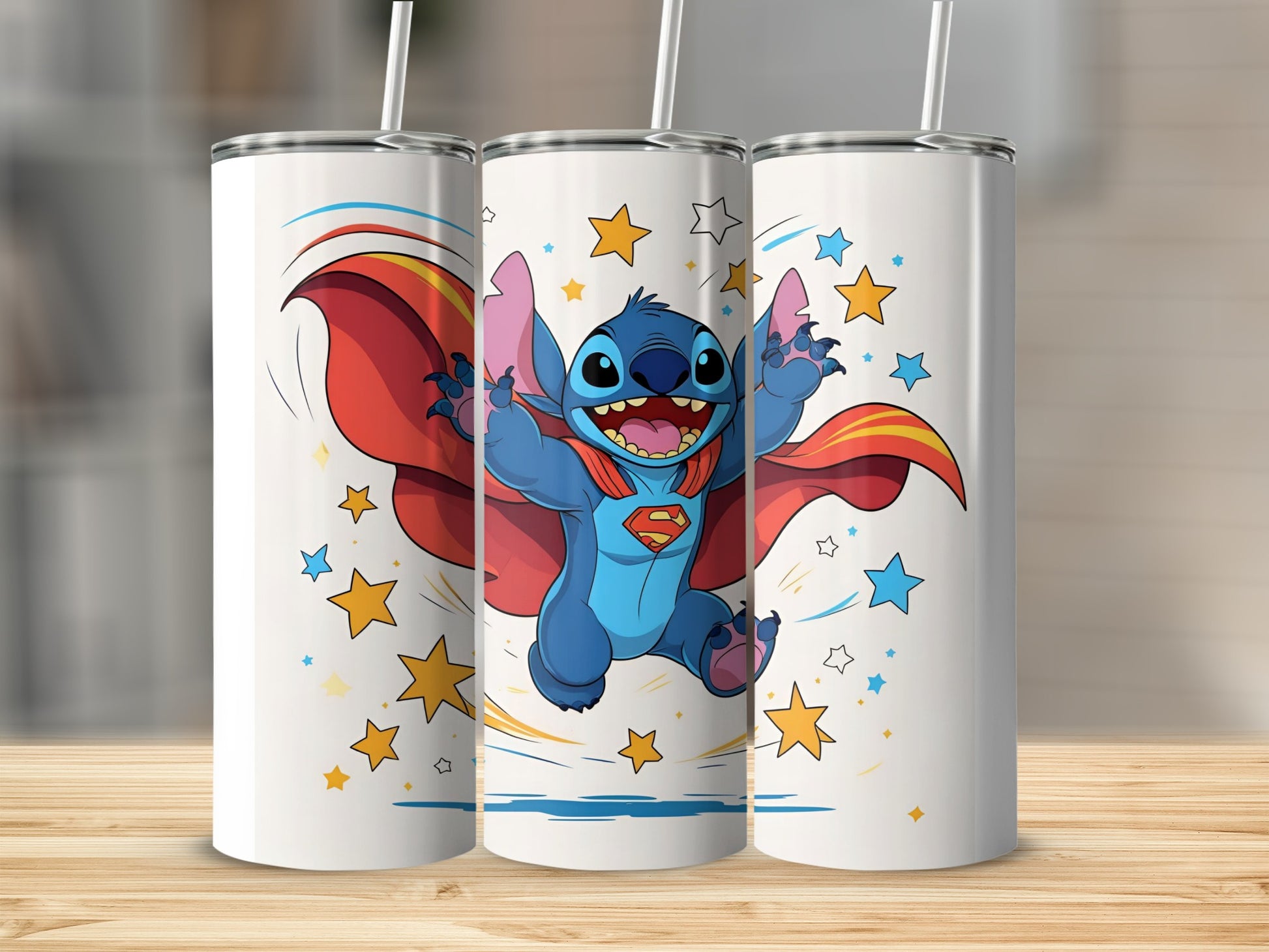 Blue alien superhero character on three white tumblers with stars and cape.