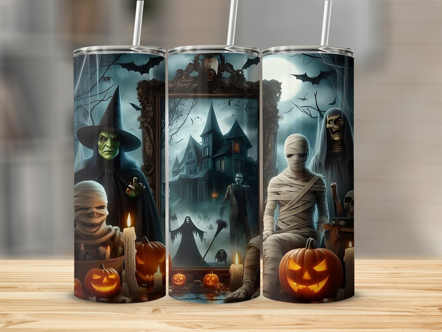 Halloween tumbler with witch, mummies, haunted house, and pumpkins.
