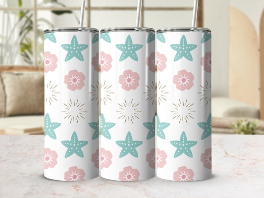 Three tumblers with starfish and floral patterns on a white surface.