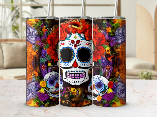 Three sugar skull tumblers decorated with vibrant flowers and skulls.