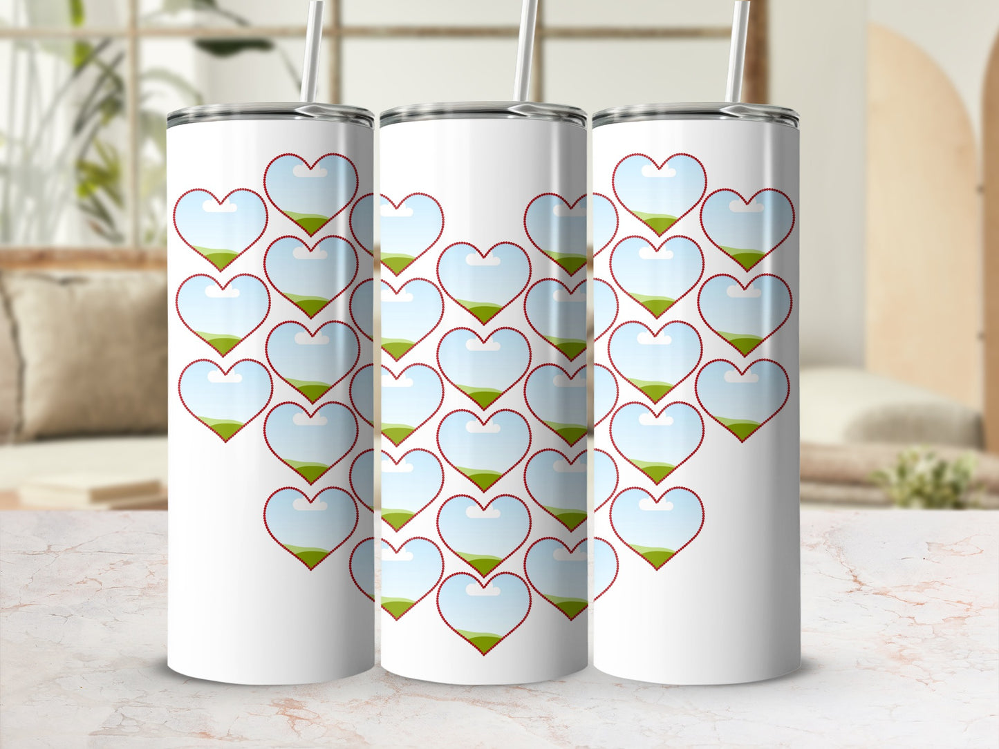 Three white tumblers with hearts filled with sky and grassy hills.