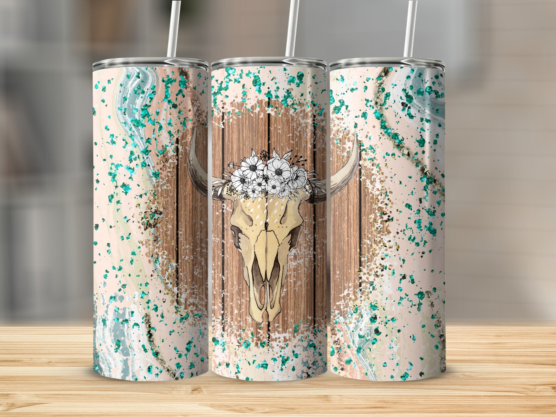 Cow skull with floral crown on wood grain background, multiple tumblers.