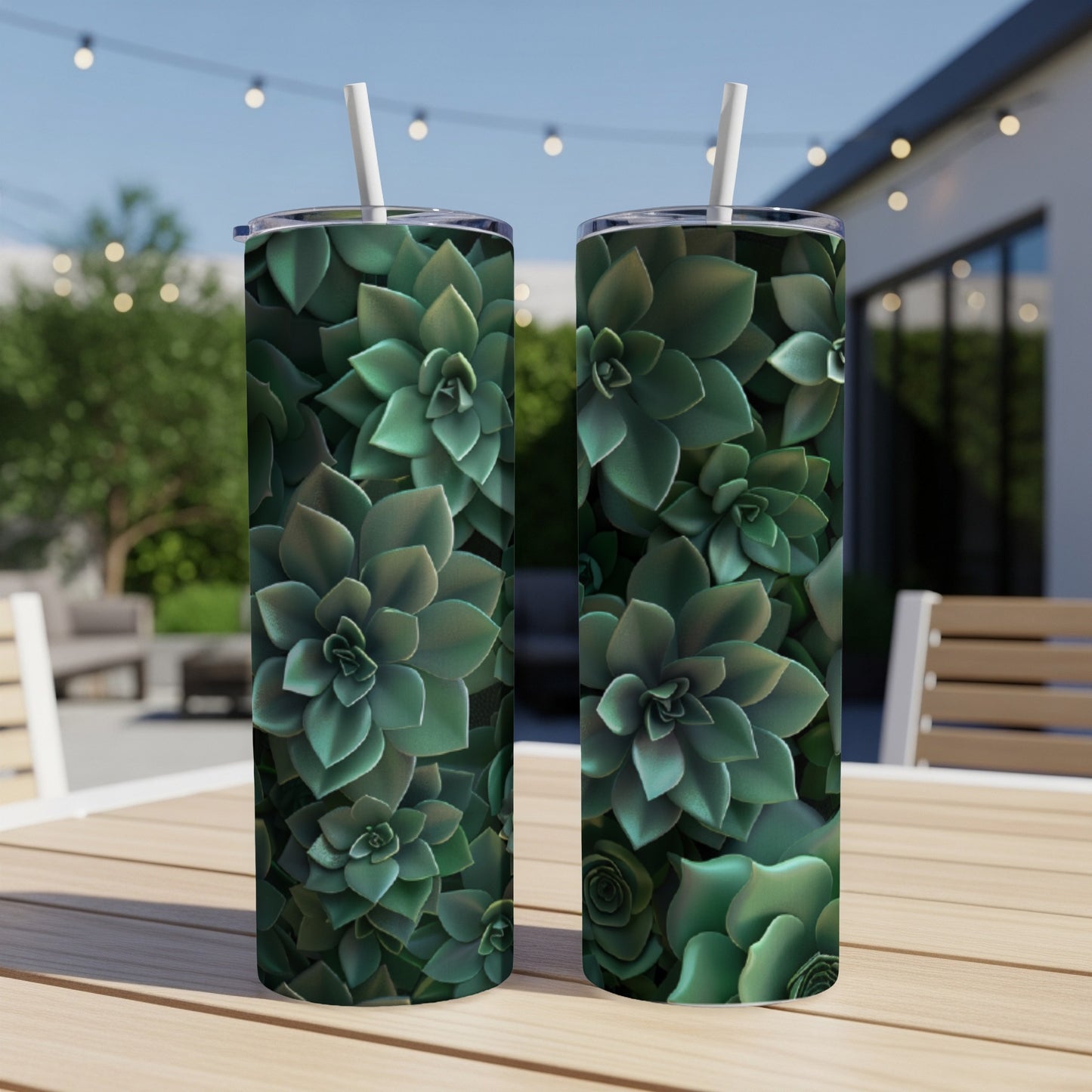 Two tumblers with a dark green succulent pattern on a wooden table.